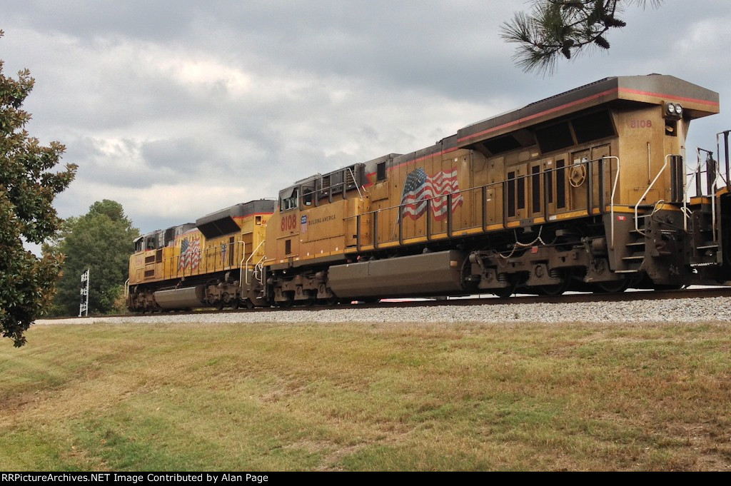 UP 8694 and 8108 wait for green